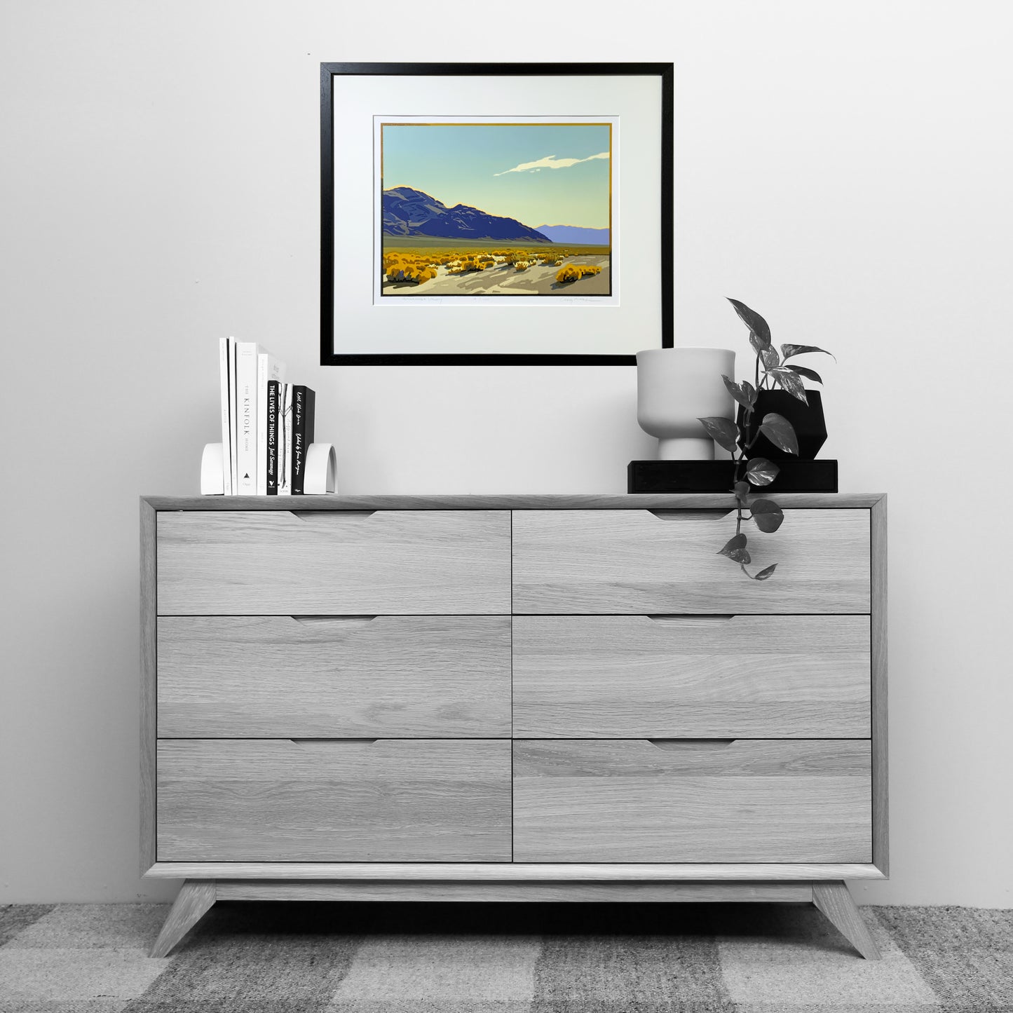 Amargosa Valley artwork shown above a dresser for scale.