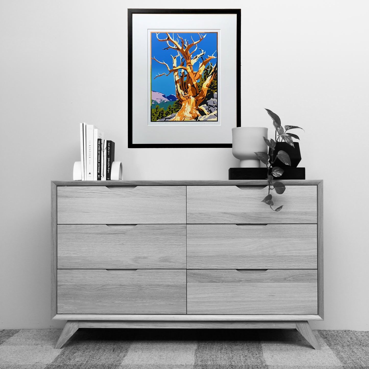 Vibrant bristlecone pine artwork shown over a dresser for scale.