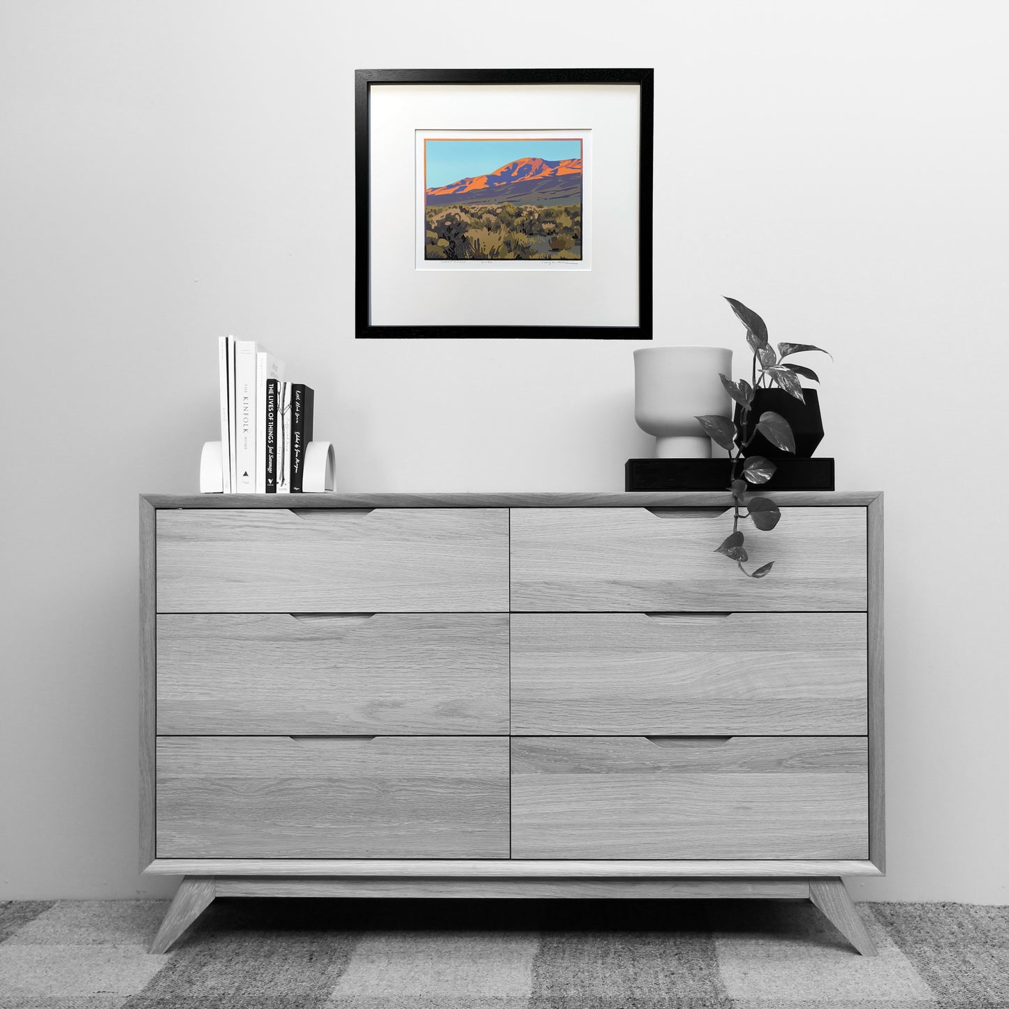 Artwork titled "Desert Finale" shown over dresser for scale
