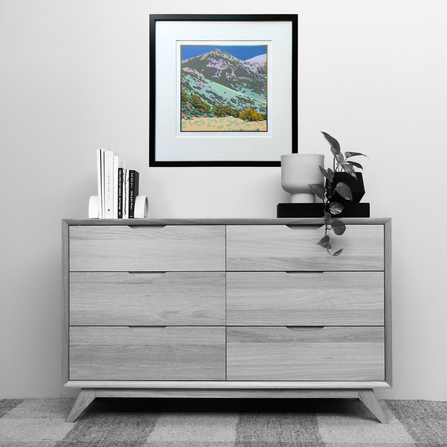 Artwork of Nevada's Toiyabe Range shown matted and framed over a dresser for scale
