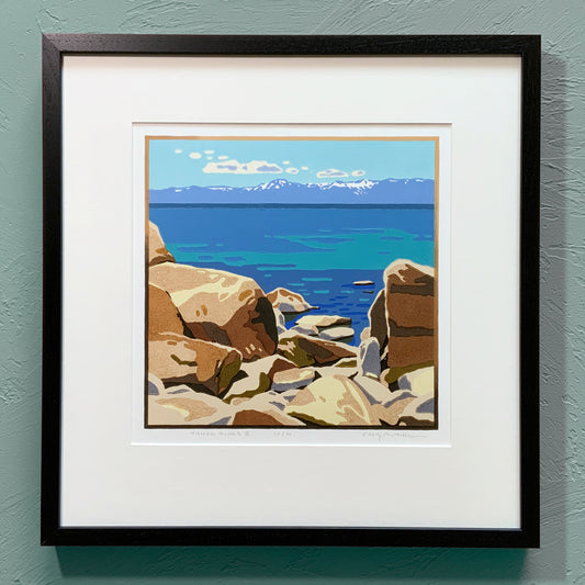 Vibrant artwork of Lake Tahoe rocks displayed against a neutral wall