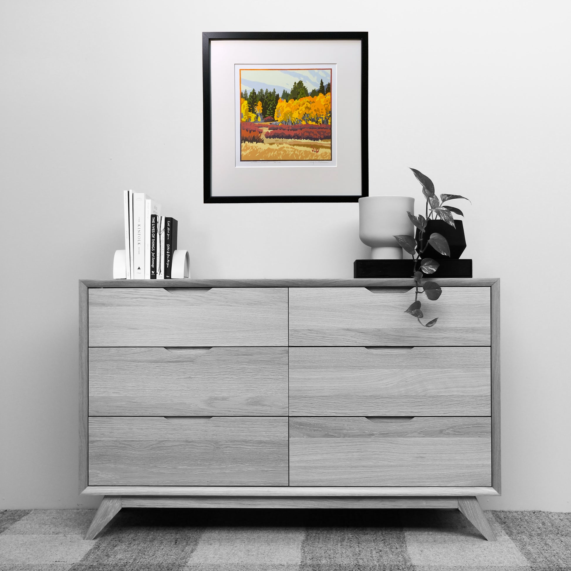 Vibrant autumn forest artwork shown above a dresser for scale